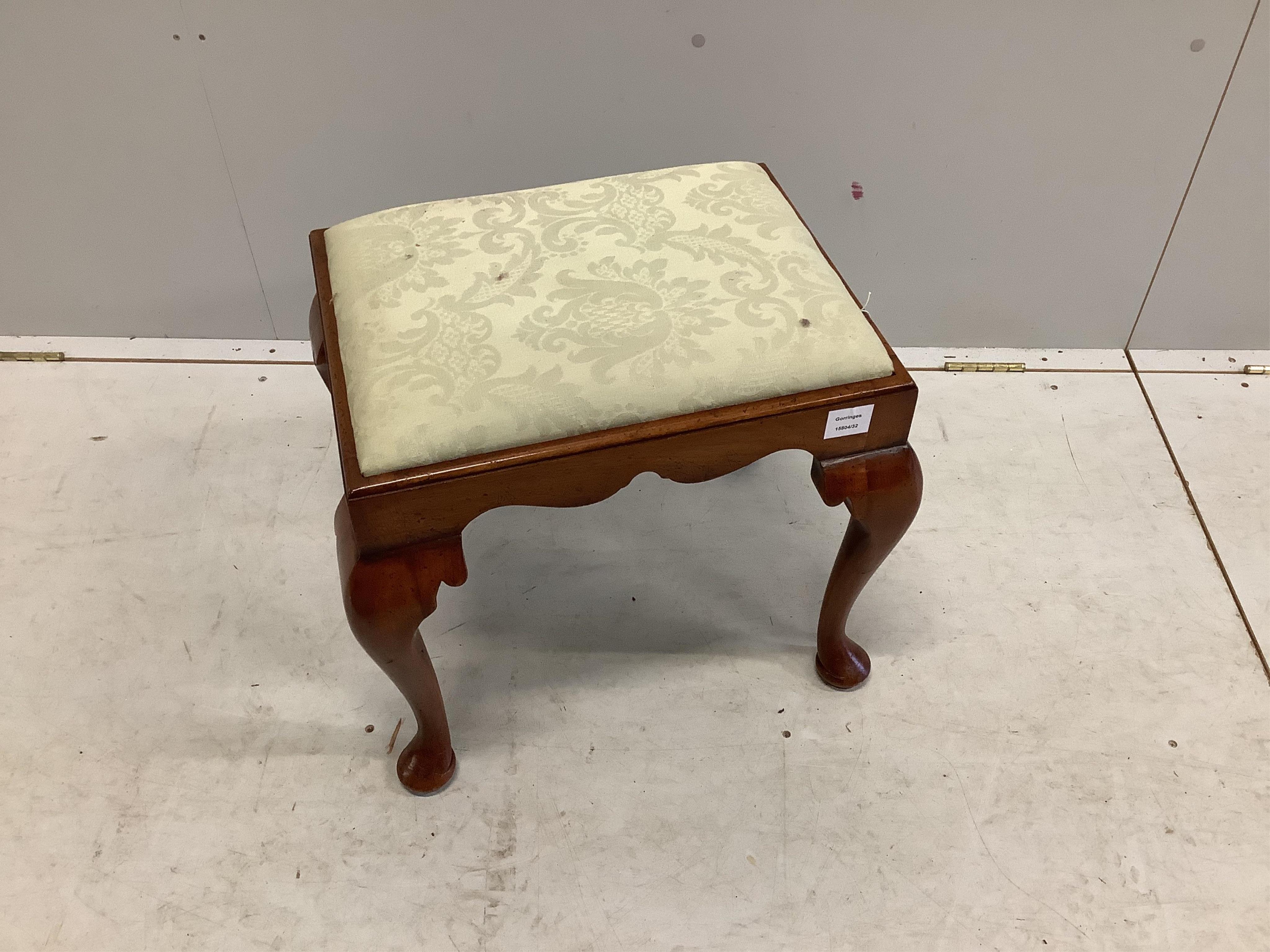 A Queen Anne style walnut dressing stool, with shaped frieze and cabriole legs, the drop in seat covered in silver fern cotton damask (Sandersons TCS, 1984), width 51cm, depth 41cm, height 45cm. Condition - fair to good